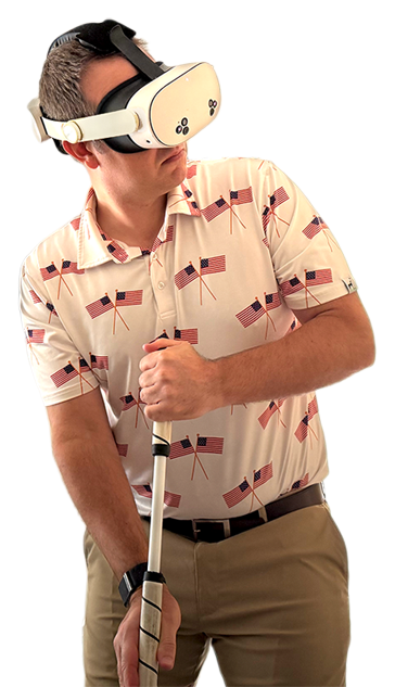 Jeff at address in a Meta Quest headset, broomstick putter upright, head turned to read the putt.